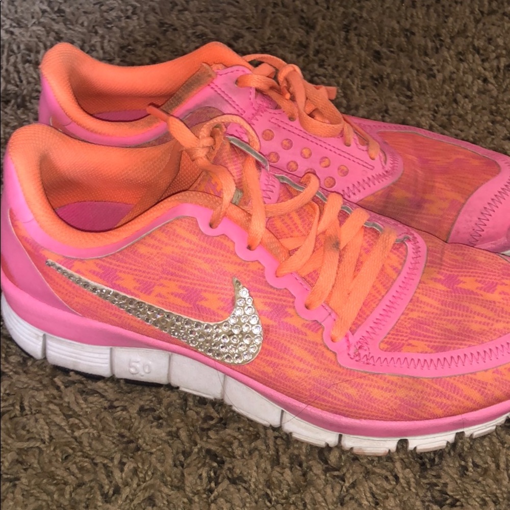 Pink and orange nike shoes